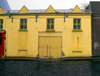 JOHN DOHERTY ~ The Yellow House - acrylic on canvas - 51 x 66 cm - POA