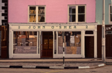 JOHN DOHERTY - The Paper Bag Shop - acrylic on linen - €18000